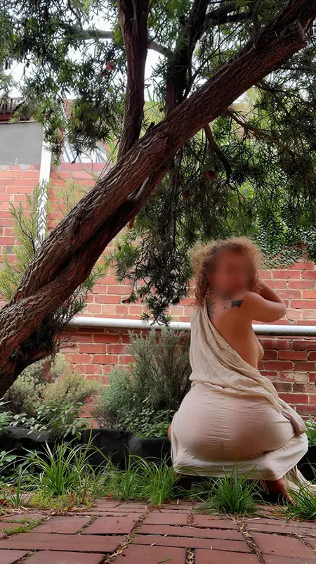 Nude massage Melbourne, masseuse Alice draped in fabric in a Melbourne garden Nude massage Melbourne, masseuse Alice draped in fabric in a Melbourne garden